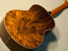 A very curly brazilian rosewood ukulele back.